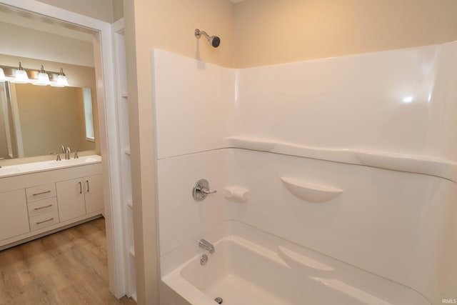 400 E Center St, North Liberty, IN 46554 - bathroom with tub / shower combination, wood finished floors, and vanity