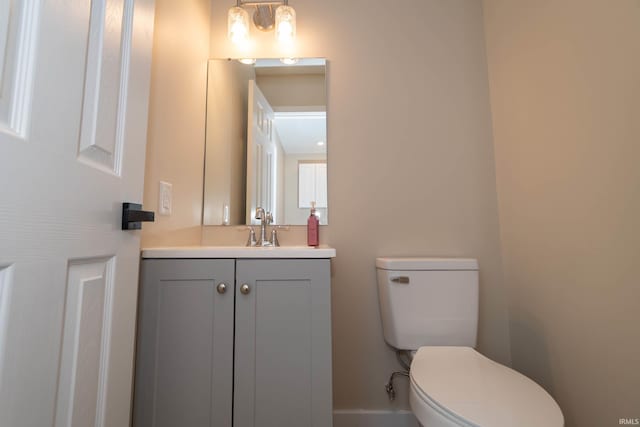 400 E Center St, North Liberty, IN 46554 - half bath featuring toilet, vanity, and baseboards