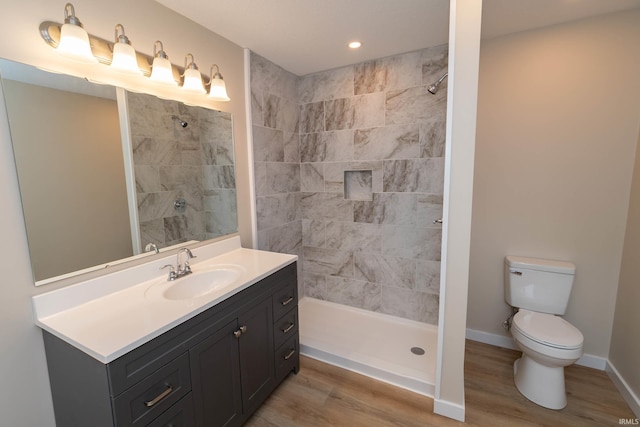400 E Center St, North Liberty, IN 46554 - bathroom featuring toilet, vanity, tiled shower, and recessed lighting