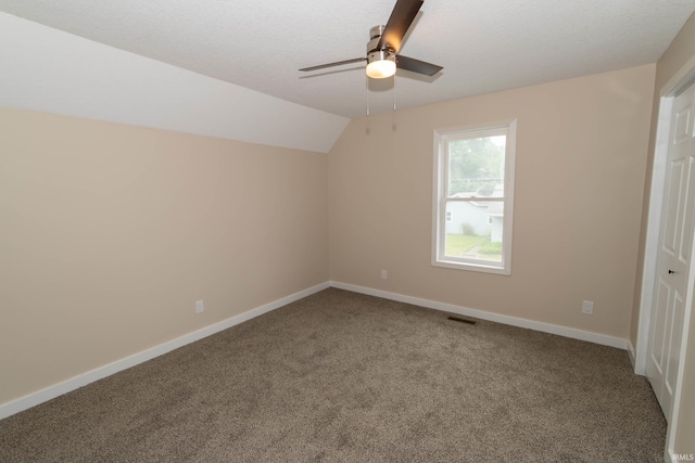 400 E Center St, North Liberty, IN 46554 - additional living space featuring carpet floors, ceiling fan, baseboards, and lofted ceiling