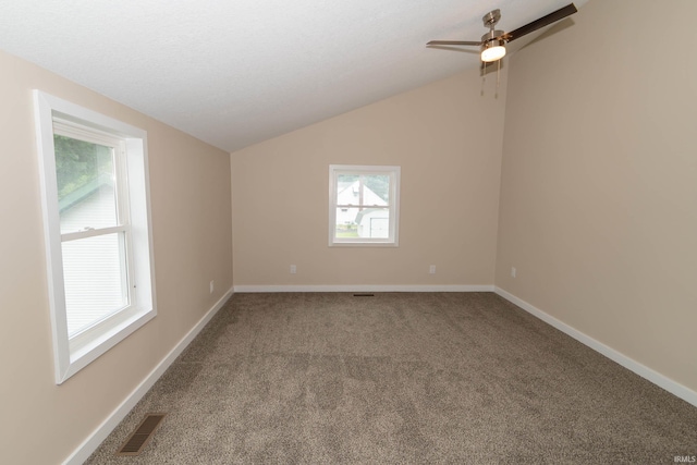 400 E Center St, North Liberty, IN 46554 - spare room featuring vaulted ceiling, carpet flooring, ceiling fan, and baseboards