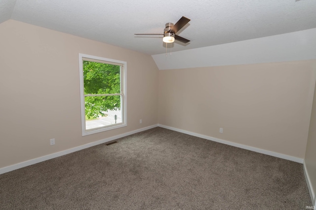 400 E Center St, North Liberty, IN 46554 - bonus room with vaulted ceiling, ceiling fan, carpet, a textured ceiling, and baseboards