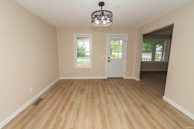 400 E Center St, North Liberty, IN 46554 - entryway featuring a chandelier, light wood finished floors, and baseboards