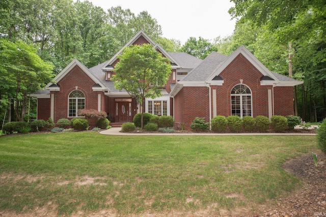 2307 Stacey Hollow Pl, Lafayette, IN 47905 - view of front of house featuring brick siding, a front yard, and a porch