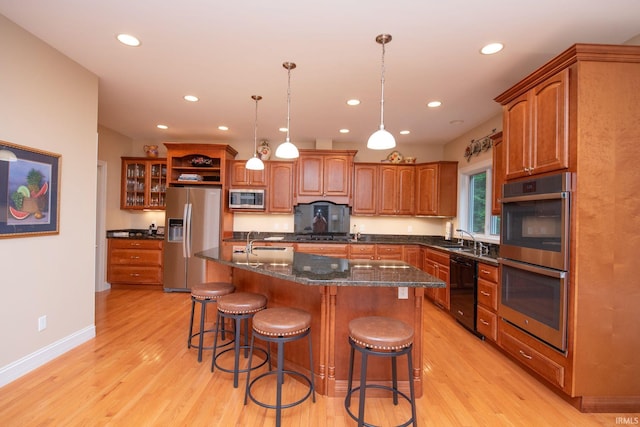 2307 Stacey Hollow Pl, Lafayette, IN 47905 - kitchen with appliances with stainless steel finishes, brown cabinets, light wood finished floors, and recessed lighting