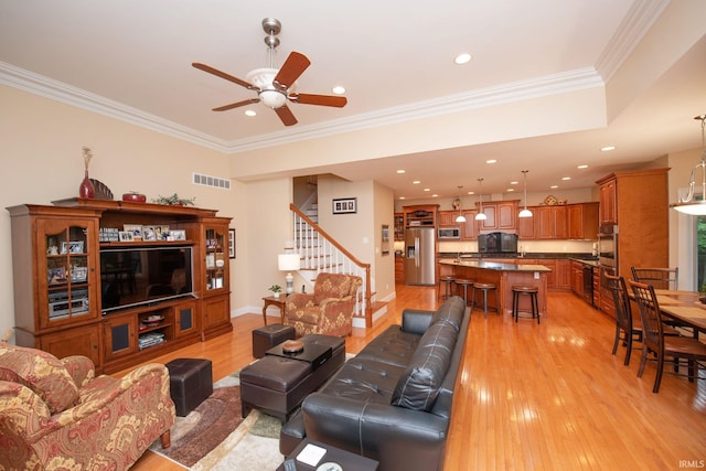 2307 Stacey Hollow Pl, Lafayette, IN 47905 - living area featuring stairway, light wood-type flooring, ceiling fan, ornamental molding, and recessed lighting