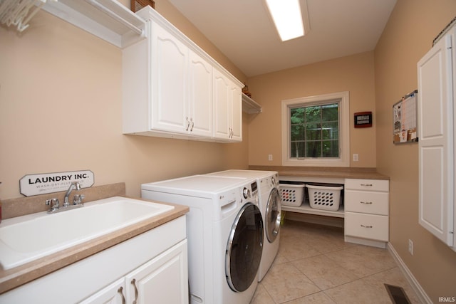 2307 Stacey Hollow Pl, Lafayette, IN 47905 - washroom featuring cabinet space, washer and clothes dryer, and light tile patterned floors