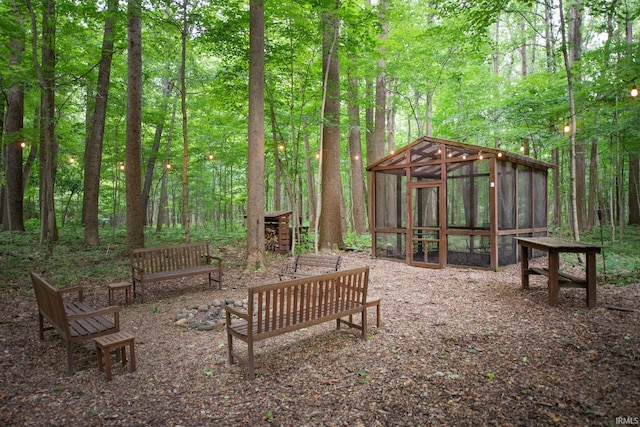2307 Stacey Hollow Pl, Lafayette, IN 47905 - view of yard featuring exterior structure, an outdoor structure, and a wooded view