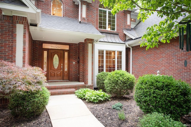 2307 Stacey Hollow Pl, Lafayette, IN 47905 - entrance to property with brick siding, roof with shingles, a standing seam roof, and covered porch