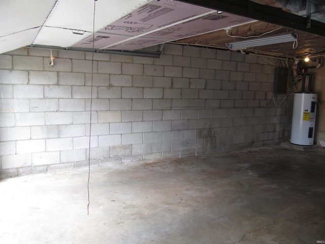 1053 E Smith Cir, Paoli, IN 47454 - basement with electric water heater, concrete block wall, and a garage