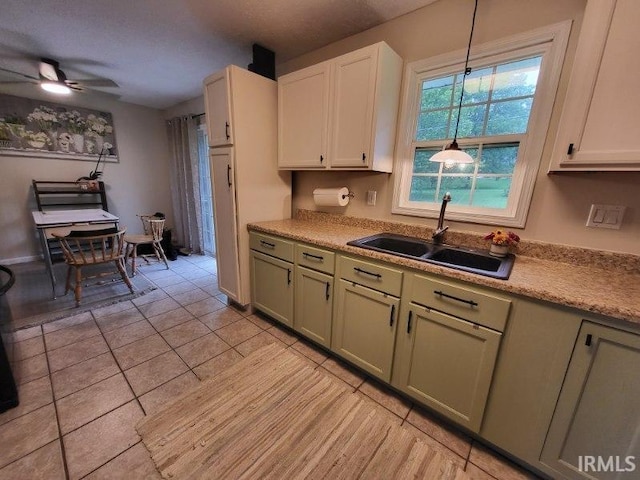 1053 E Smith Cir, Paoli, IN 47454 - kitchen with a sink, light tile patterned flooring, ceiling fan, and light countertops