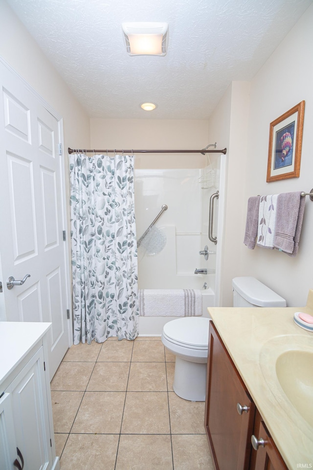 4654 Ironstone Ln, West Lafayette, IN 47906 - bathroom with vanity, toilet, shower / tub combo, tile patterned floors, and a textured ceiling