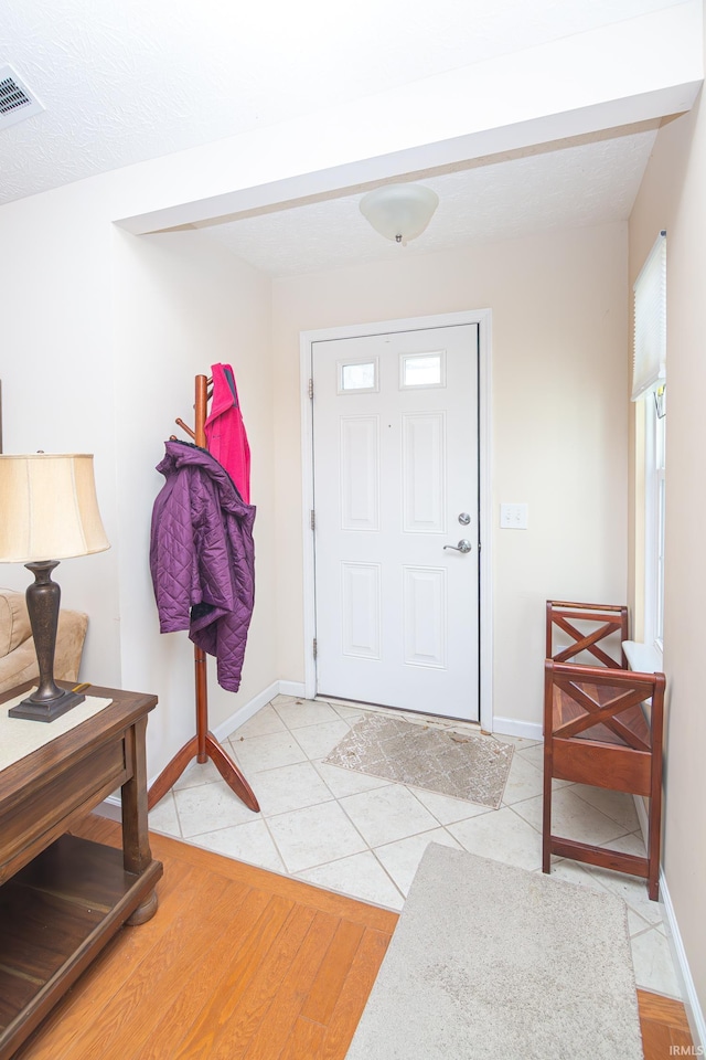 4654 Ironstone Ln, West Lafayette, IN 47906 - foyer entrance featuring baseboards and light tile patterned floors