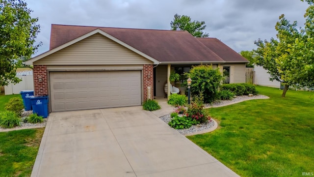 17 Chrysler Ave, Wabash, IN 46992 - view of front of home with a garage, brick siding, concrete driveway, and a front yard