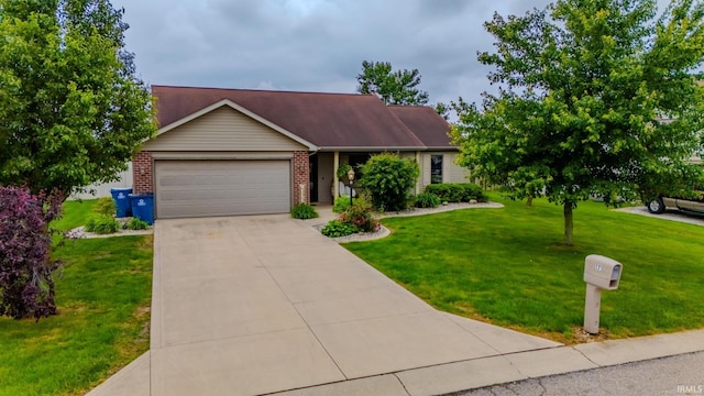 17 Chrysler Ave, Wabash, IN 46992 - view of front of property featuring a garage, driveway, brick siding, and a front yard