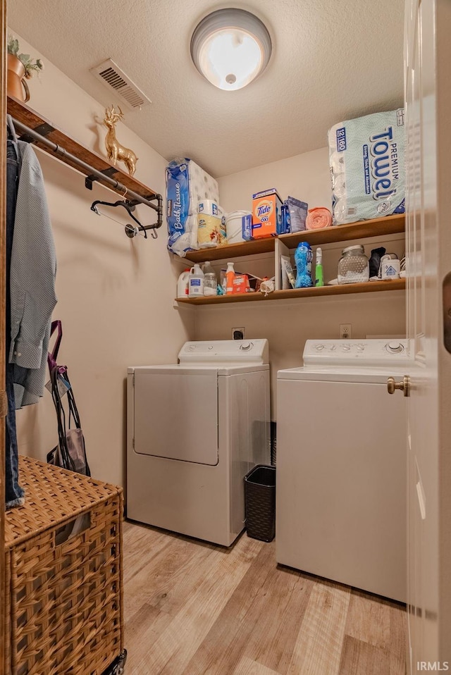 17 Chrysler Ave, Wabash, IN 46992 - washroom with independent washer and dryer, light wood-style floors, and a textured ceiling