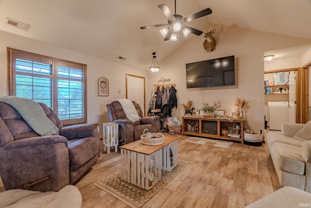 17 Chrysler Ave, Wabash, IN 46992 - living room with washer and dryer, light wood finished floors, ceiling fan, and vaulted ceiling