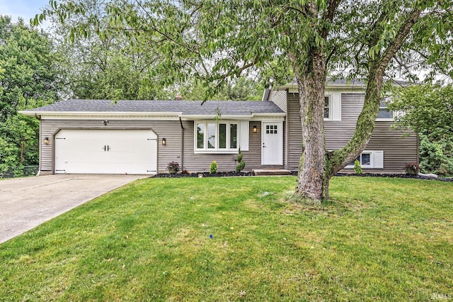 57372 Arabian Dr, Goshen, IN 46528 - split level home featuring a garage, driveway, a front lawn, and a chimney