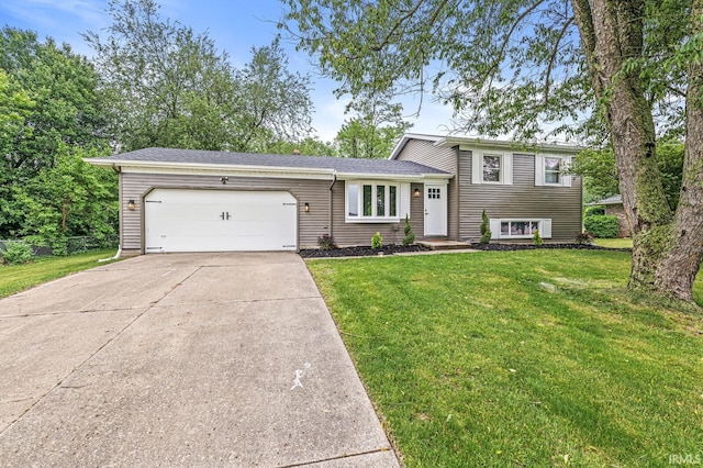 57372 Arabian Dr, Goshen, IN 46528 - tri-level home featuring an attached garage, driveway, and a front lawn
