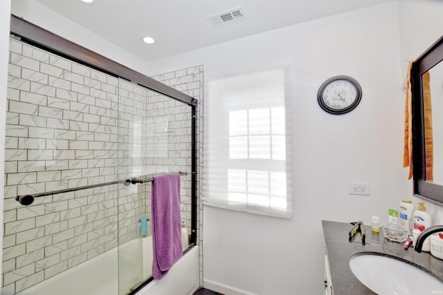 8020 N W Shafer Dr, Monticello, IN 47960 - bathroom featuring shower / bath combination with glass door, healthy amount of natural light, vanity, recessed lighting, and baseboards