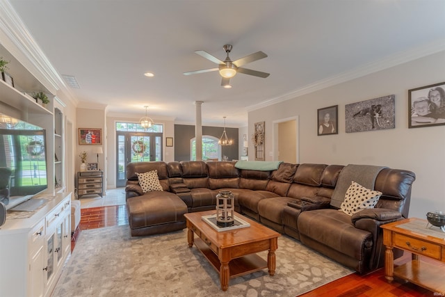 2534 Wheaton Dr, Evansville, IN 47725 - living area with crown molding, light wood-style floors, a ceiling fan, and a chandelier