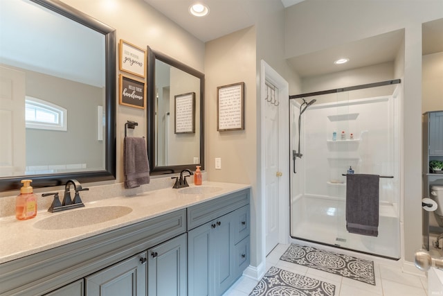 2534 Wheaton Dr, Evansville, IN 47725 - bathroom featuring tile patterned flooring, a shower stall, double vanity, and baseboards