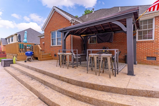 2534 Wheaton Dr, Evansville, IN 47725 - view of patio featuring a gazebo, a deck, outdoor dining area, and a grill