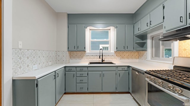 4112 Arlington Ave, Fort Wayne, IN 46807 - kitchen with stainless steel appliances, a sink, extractor fan, tasteful backsplash, and light tile patterned flooring