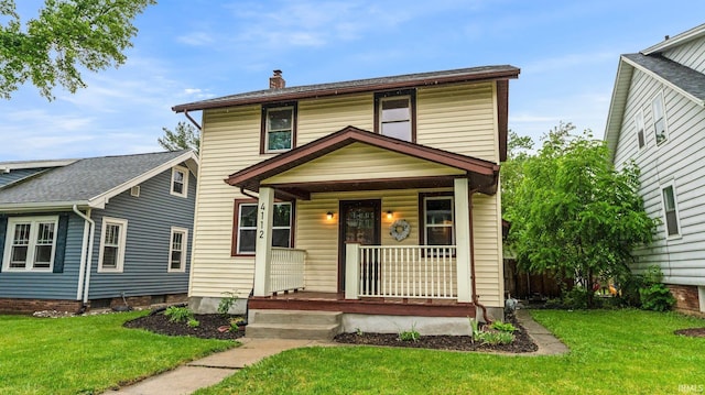 4112 Arlington Ave, Fort Wayne, IN 46807 - american foursquare style home featuring covered porch, a chimney, and a front lawn