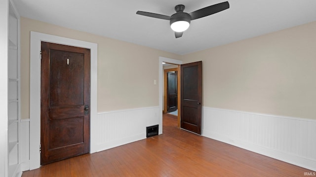 4112 Arlington Ave, Fort Wayne, IN 46807 - unfurnished room featuring wainscoting, wood finished floors, and ceiling fan