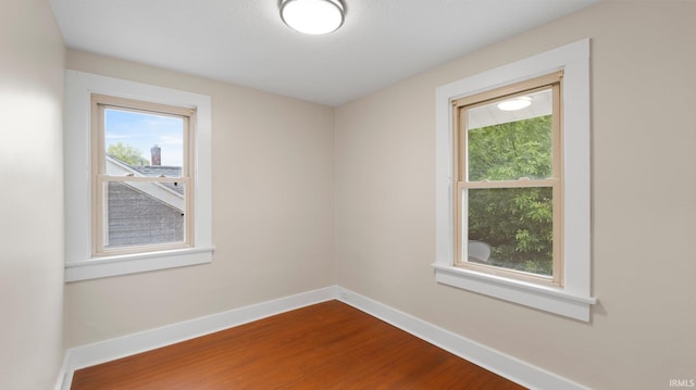 4112 Arlington Ave, Fort Wayne, IN 46807 - unfurnished room with healthy amount of natural light, dark wood-type flooring, and baseboards
