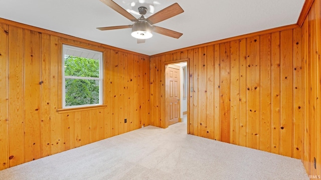 4112 Arlington Ave, Fort Wayne, IN 46807 - empty room with carpet, a ceiling fan, and wooden walls