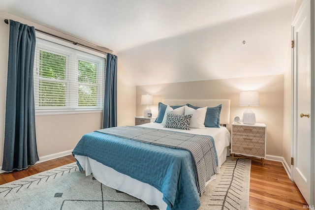 531 W Angela Blvd, South Bend, IN 46617 - bedroom with wood finished floors, baseboards, and lofted ceiling