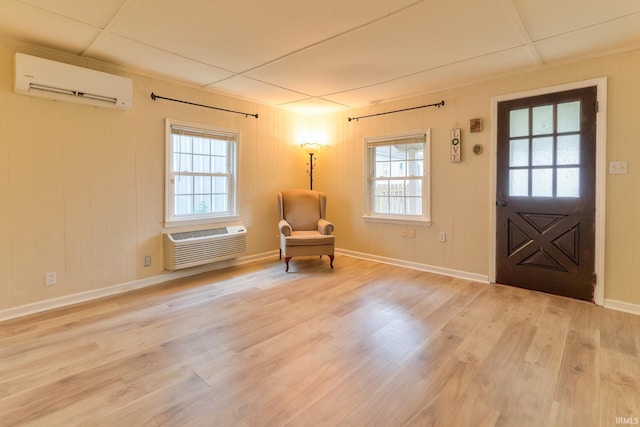 14 S Villa Dr, Evansville, IN 47714 - entryway featuring a wall unit AC, an AC wall unit, light wood-style floors, and baseboards