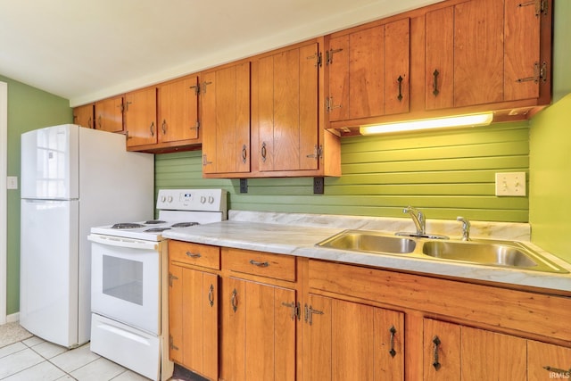 14 S Villa Dr, Evansville, IN 47714 - kitchen featuring white appliances, light countertops, a sink, light tile patterned flooring, and brown cabinets