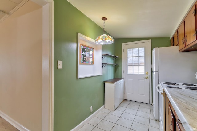 14 S Villa Dr, Evansville, IN 47714 - kitchen with white range with electric stovetop, brown cabinetry, light tile patterned flooring, light countertops, and hanging light fixtures