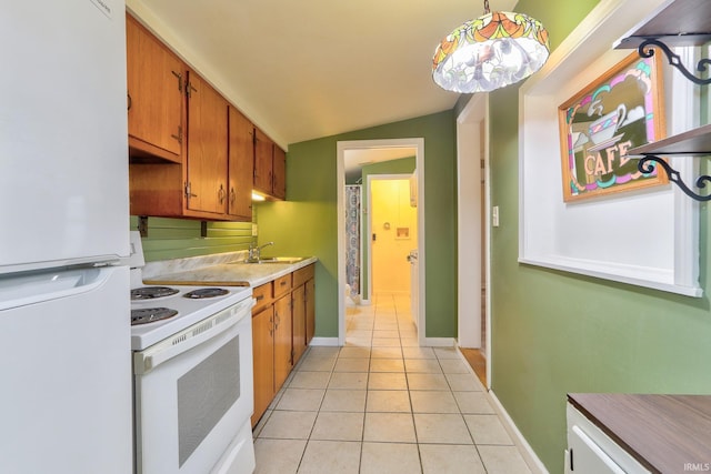 14 S Villa Dr, Evansville, IN 47714 - kitchen featuring white appliances, a sink, light tile patterned flooring, vaulted ceiling, and brown cabinets