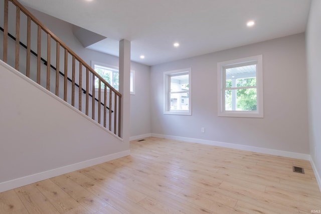 1026 S 35th St, South Bend, IN 46615 - empty room with plenty of natural light, baseboards, wood finished floors, and recessed lighting