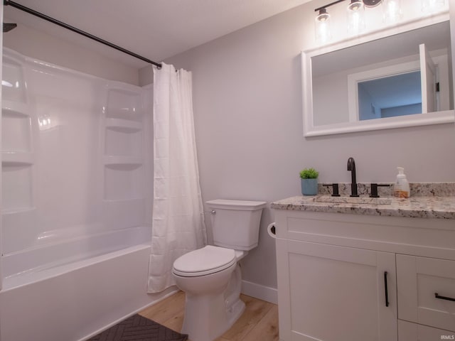 1026 S 35th St, South Bend, IN 46615 - bathroom with vanity, wood finished floors, toilet, shower / bath combination with curtain, and baseboards
