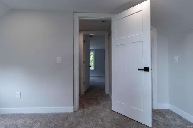 1026 S 35th St, South Bend, IN 46615 - hallway featuring carpet floors, baseboards, and vaulted ceiling