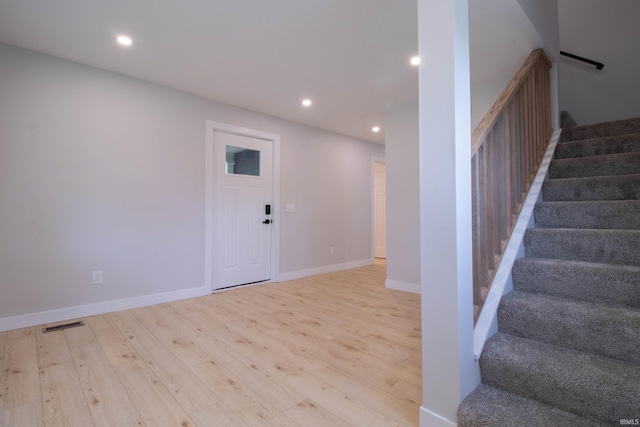 1026 S 35th St, South Bend, IN 46615 - staircase featuring wood finished floors, recessed lighting, and baseboards