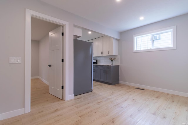 1026 S 35th St, South Bend, IN 46615 - kitchen with freestanding refrigerator, tasteful backsplash, baseboards, white cabinets, and recessed lighting