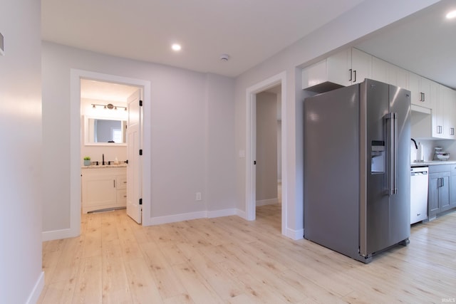 1026 S 35th St, South Bend, IN 46615 - kitchen featuring stainless steel refrigerator with ice dispenser, dishwasher, light wood-type flooring, white cabinetry, and recessed lighting