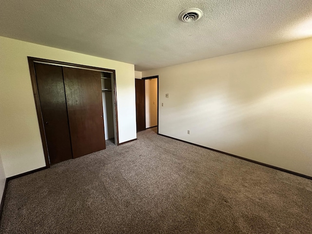 4218 Turf Ln, Fort Wayne, IN 46804 - unfurnished bedroom with carpet, a closet, baseboards, and a textured ceiling