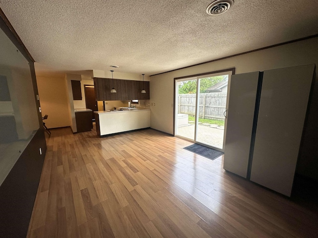 4218 Turf Ln, Fort Wayne, IN 46804 - unfurnished living room with wood finished floors and a textured ceiling