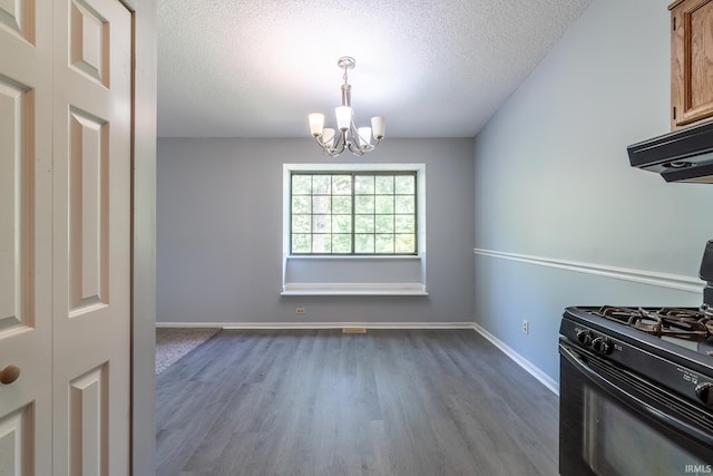 7914 Stonegate Pl, Fort Wayne, IN 46825 - unfurnished dining area featuring a chandelier, dark wood-type flooring, a textured ceiling, and baseboards