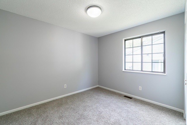 7914 Stonegate Pl, Fort Wayne, IN 46825 - empty room featuring carpet, a textured ceiling, and baseboards