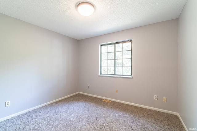 7914 Stonegate Pl, Fort Wayne, IN 46825 - carpeted spare room with baseboards and a textured ceiling