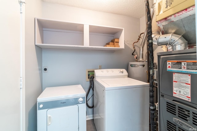 7914 Stonegate Pl, Fort Wayne, IN 46825 - laundry room with separate washer and dryer, a textured ceiling, and heating unit