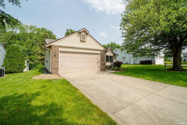 7914 Stonegate Pl, Fort Wayne, IN 46825 - view of front of home with driveway, a garage, a front yard, and brick siding